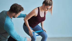Woman training with a personal trainer at next level personal training