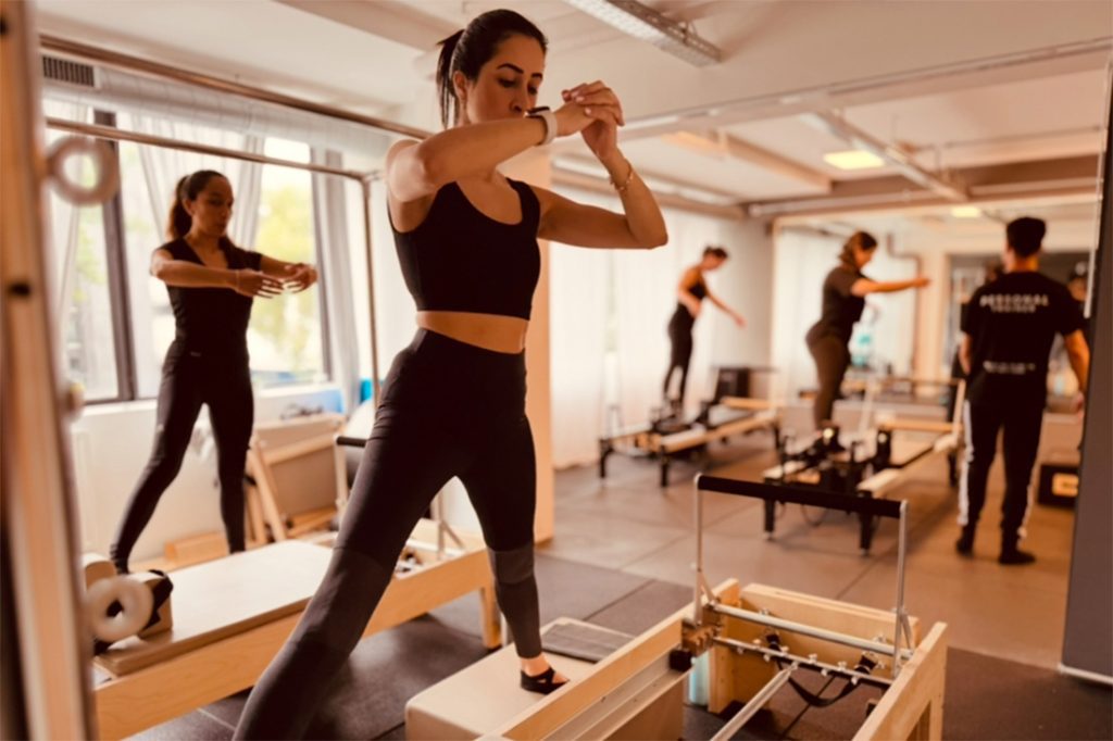 Reformer Pilates class with 6 participants at Next Level AMS studio in Amstelveen