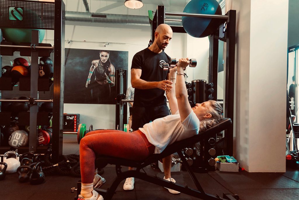 Personal training session at Next Level AMS boutique studio in Amstelveen with coach guiding client