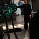 Trainer preparing a barbell at NXT LVL Amsterdam South